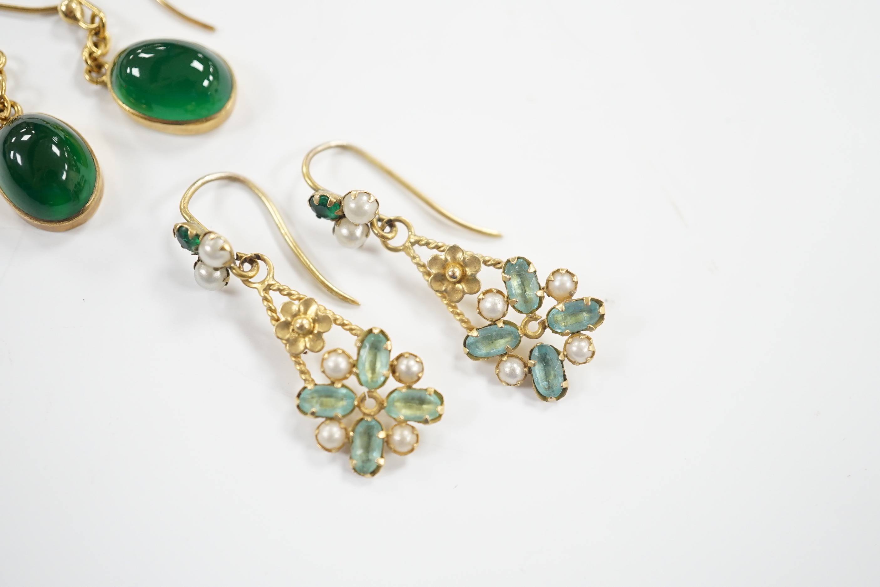 A pair of yellow metal and cabochon chrysoprase set drop earrings and a pair of yellow metal, aquamarine coloured stone and split pearl cluster set drop earrings, gross weight 5.6 grams.